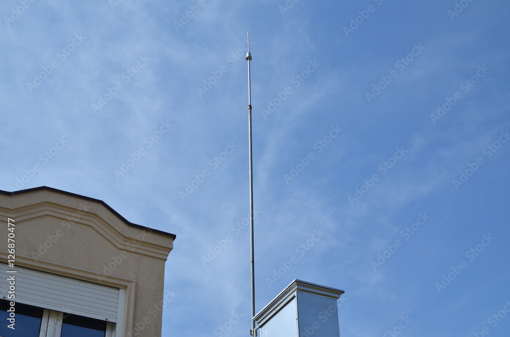 Lightning rod on a building directed to the sky Lightning rod on a building directed to the sky