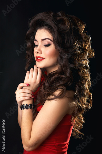 woman on a black background. makeup. curly hair. 