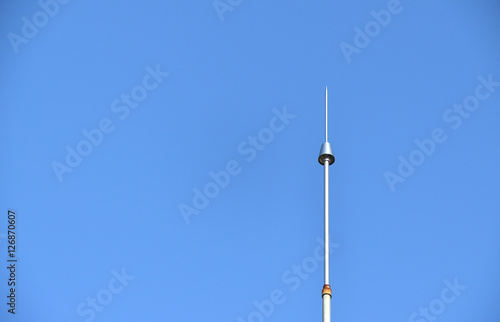 Lightning conductor against the clear blue sky photo