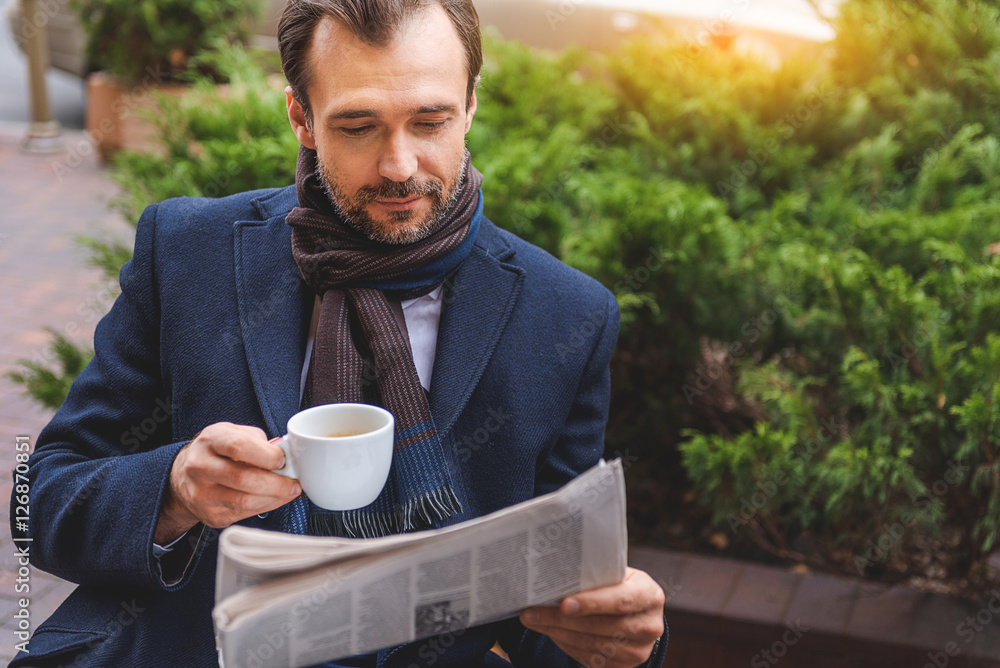 Serene businessman is interested in news Serene businessman is interested in news