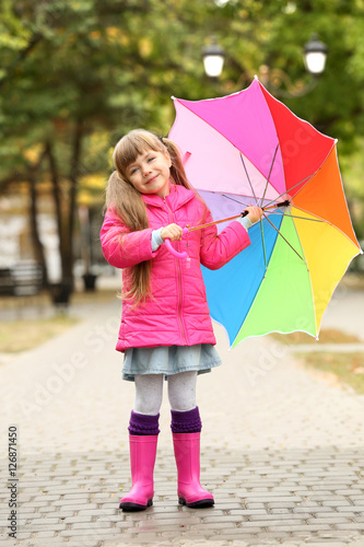 Cute girl with colorful umb...
