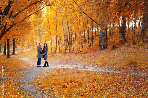 Beautiful young couple in autumn park