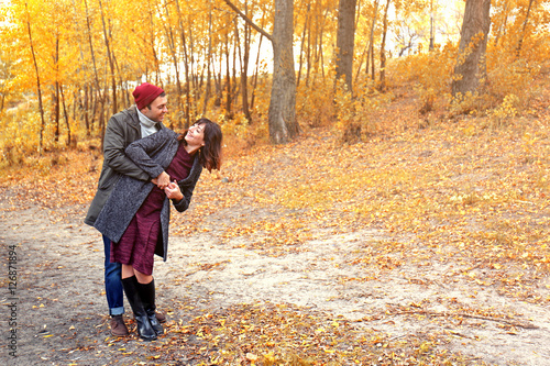 Beautiful young couple in autumn park © Africa Studio