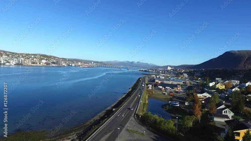 Aerial rising view of the road in front of the city of Tomso, in north Norway Aerial rising view of the road in front of the city of Tomso, in north Norway