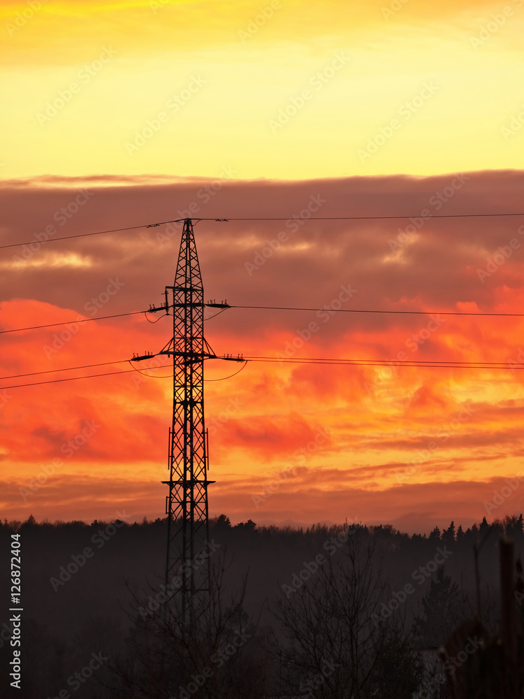 High voltage electric power line during sunset.