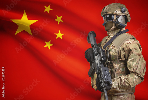 Soldier in helmet holding machine gun with flag on background series - China