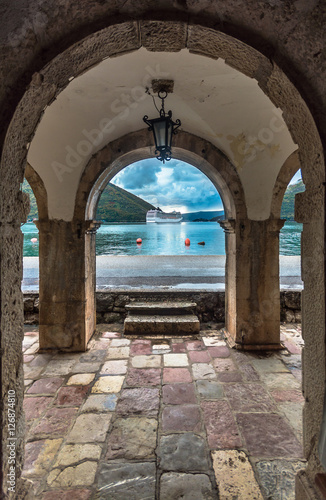 View through museum archway in the old town Perast
