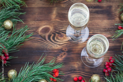 Christmas holiday wooden composition with champaign, pine branch