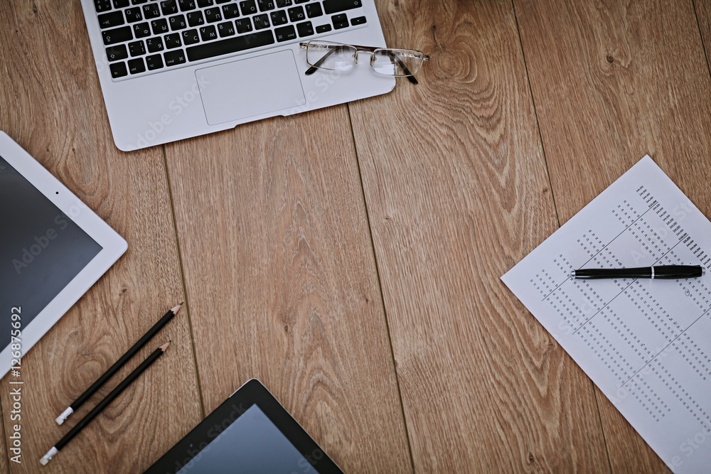 Fototapeta premium Office workplace with a laptop and documents