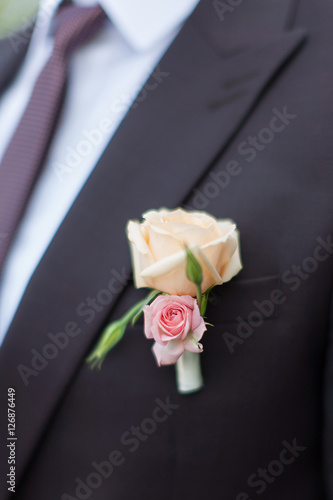 Boutonniere on groom's wedding jacket