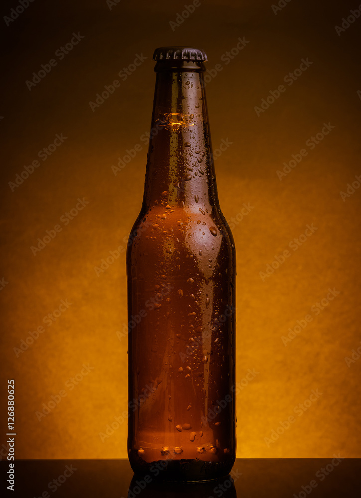 fresh cold beer ale bottle with drops and stopper