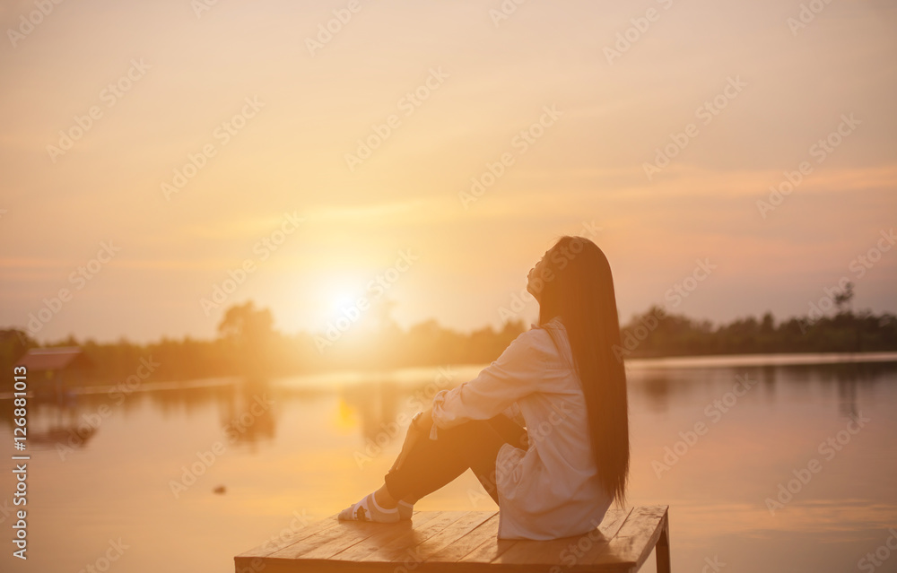 Silhouette of the beautiful girl in the nature at summer sunset. Silhouette of the beautiful girl in the nature at summer sunset.
