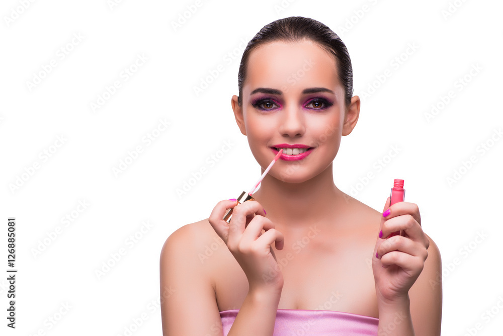 Woman applying lipstick isolated on white Woman applying lipstick isolated on white
