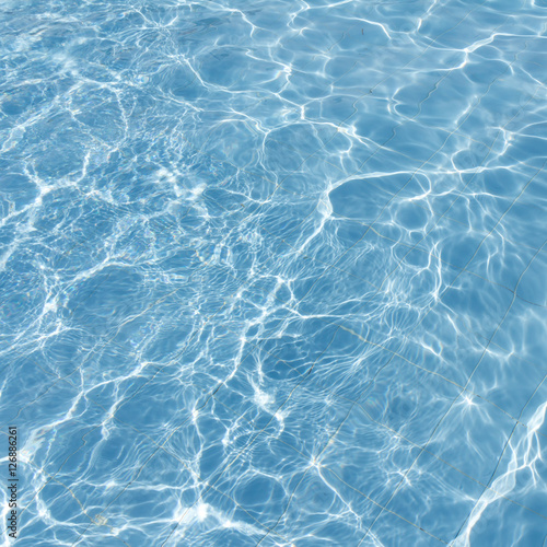 Surface of swimming pool water background © warongdech
