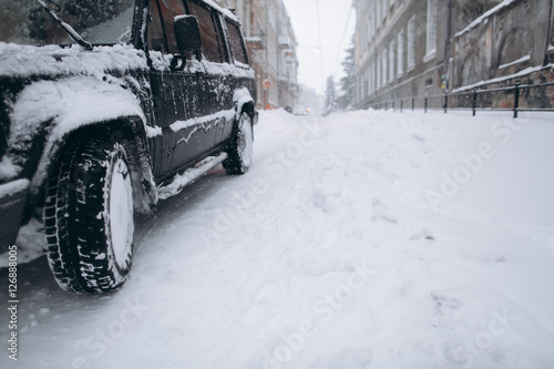 Car on a snowy road in winter