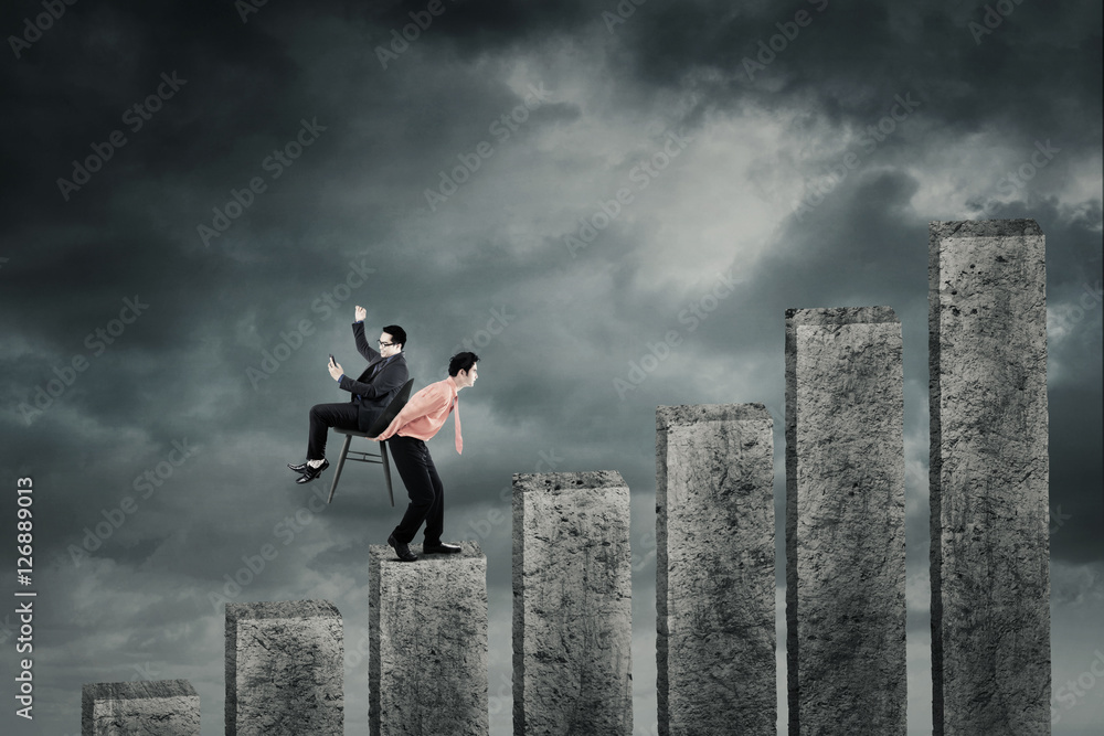 Businessman carrying partner on the business chart