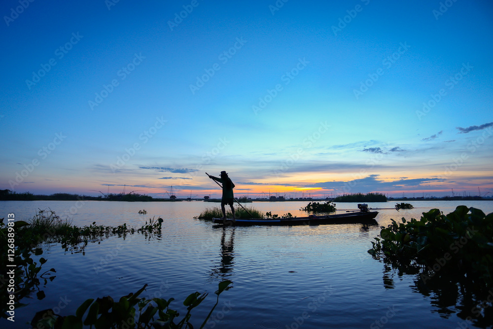 Fototapeta premium The fishermen go out early for fish. Fishermen in Inle lakes sunset, Myanmar. 
