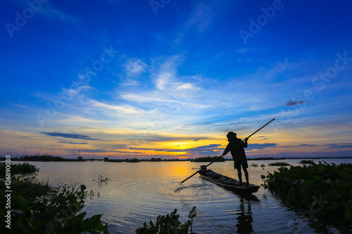 Fishermen in Inle lakes sunset, Myanmar. Fishermen is finish a day of fishing in Inle lake, Myanmar (Burma). Inle is one of the most favorite tourist places in Myanmar (Burma) © ell