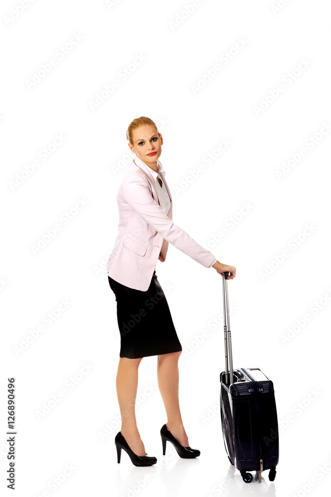 Young business woman waiting for travel with suitcase Young business woman waiting for travel with suitcase