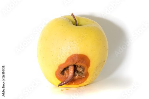 Valokuva Rotten apple with a large worm isolated on white