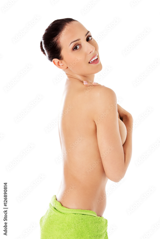 Fototapeta premium Young beautiful woman after bath full portrait isolated over white.