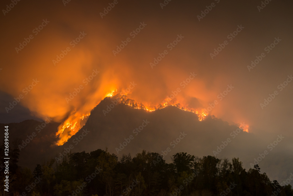 The forest fire claiming more acres at Party Rock at Lake Lure in the Blue Ridge Mountains of North Carolina. 