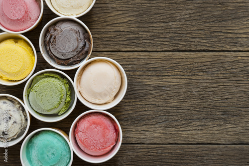 Top view Ice cream flavors in cup on blackground..