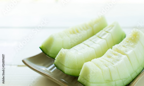 Juicy slice melon on plate