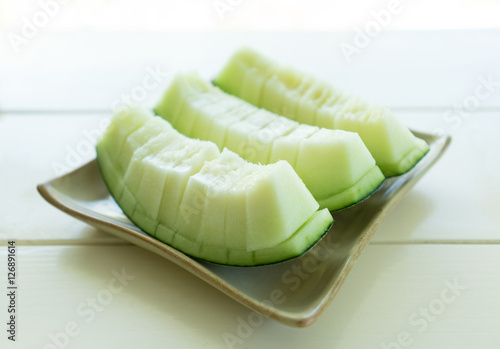 Juicy slice melon on plate