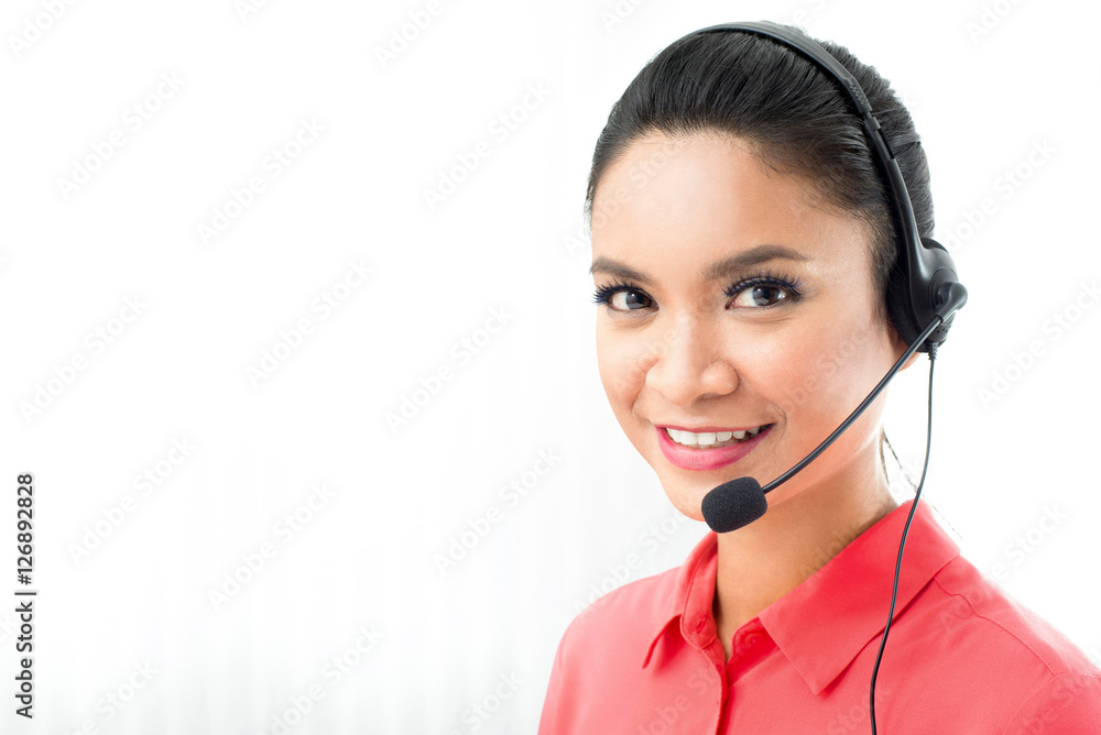 Woman wearing microphone headset working in call center Woman wearing microphone headset working in call center