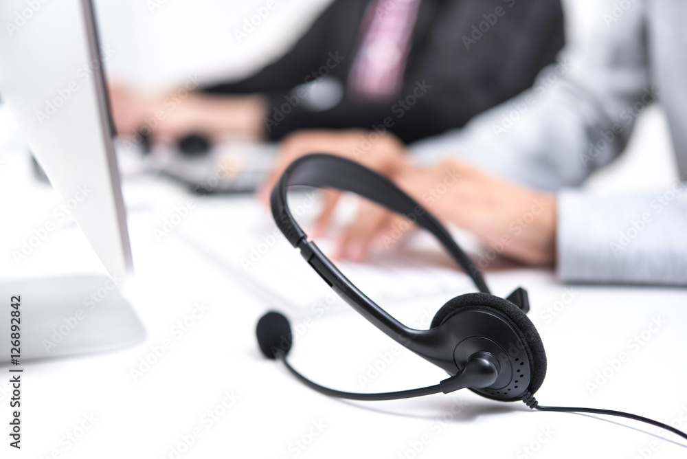 Microphone headset on the table in call center Microphone headset on the table in call center