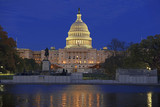 The Capitol Building in Washington DC at night with reflection in pond, capital of the United States of America