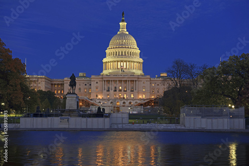 The Capitol Building in Washington DC at night with reflection in pond, capital of the United States of America