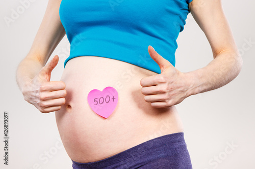 Wallpaper Mural Pregnant woman with inscription 500+ showing thumbs up, social program and policy in Poland Torontodigital.ca