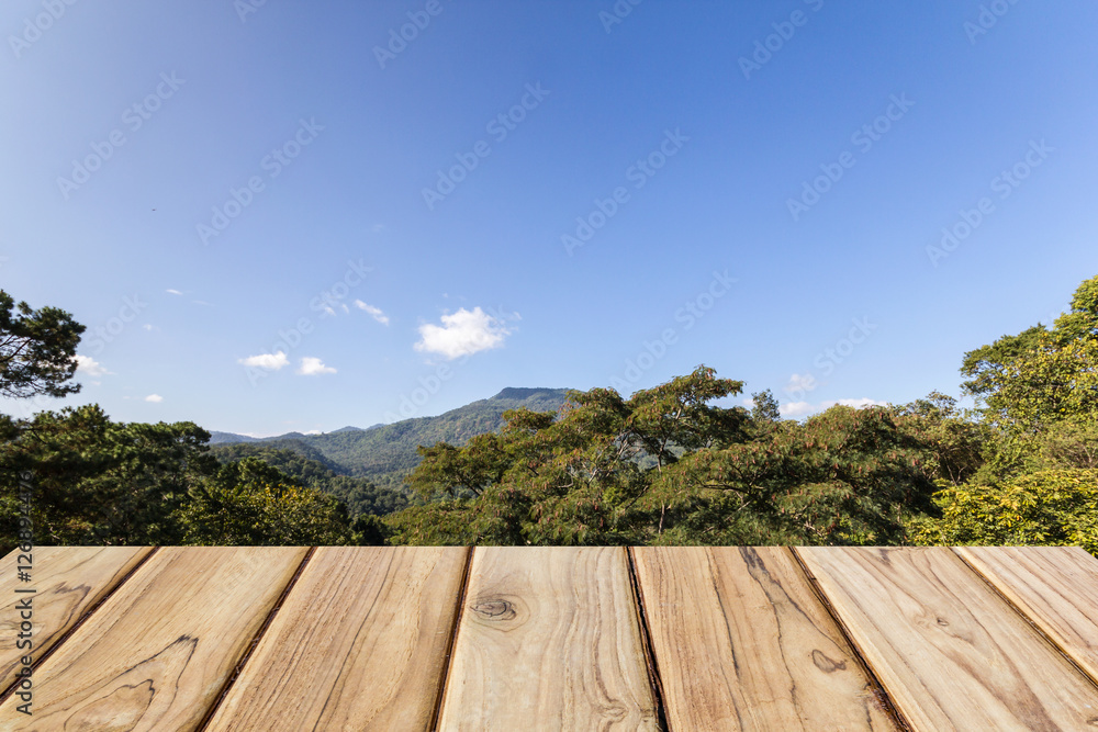 Fototapeta premium wood table with mountain and blue sky