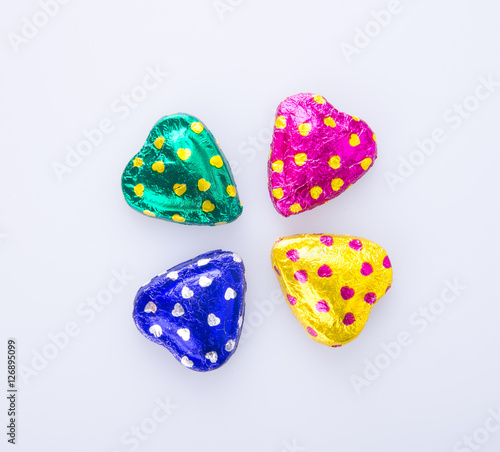 Chocolate or Colorful heart shape chocolate on a background.