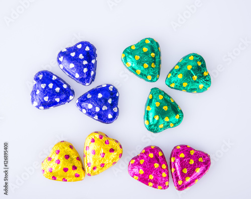 Chocolate or Colorful heart shape chocolate on a background.