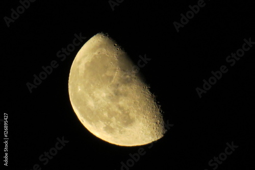 Waning gibbous moon in a dark sky.