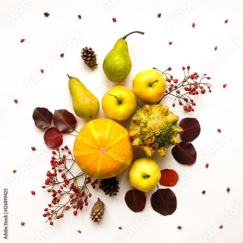 Stylish composition of vegetables, fruits, autumn leaves, berries. Top view on white background. Autumn flat lay