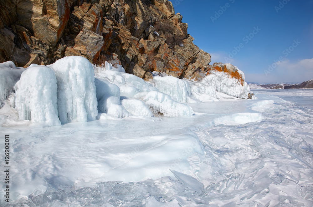 Rocks covered by ice on winter siberian Baikail lake