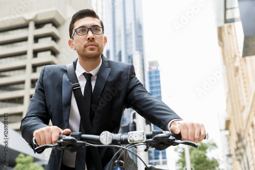 Young businessmen with a bike