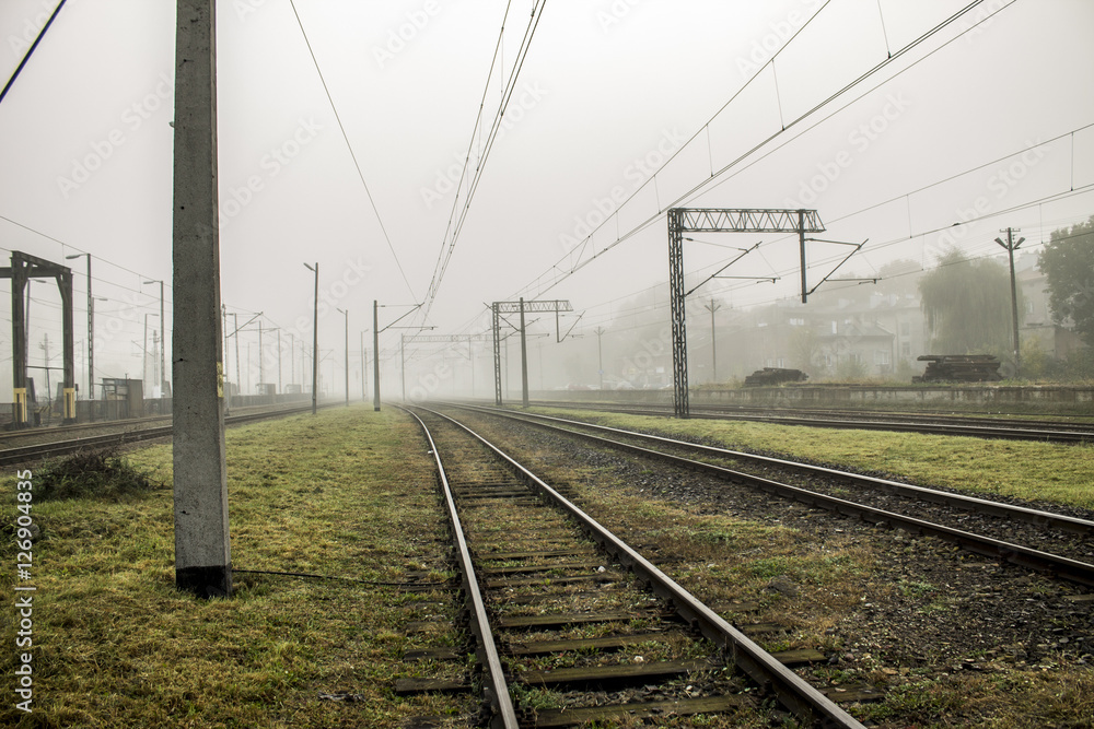 Railroad tracks and fog