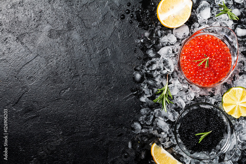 Glass bowl with red and black caviar