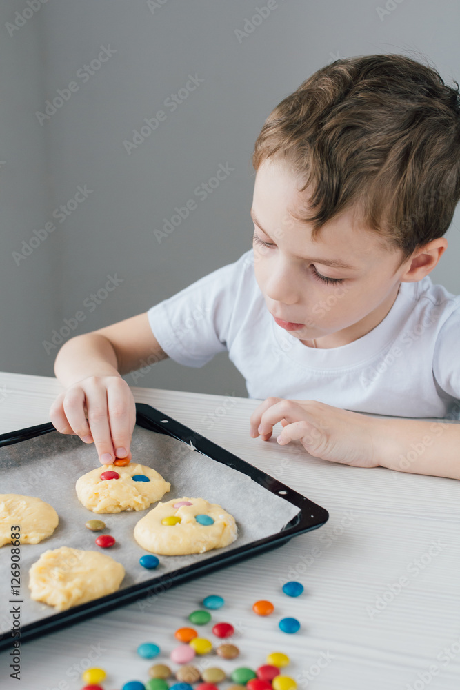 The child prepares homemade Christmas cookies The child prepares homemade Christmas cookies