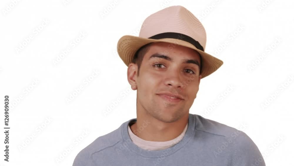 Happy millennial Hispanic mixed race man standing on white background with hat. Fashionable young Mexican man in 20s wearing fedora. Copy space Happy millennial Hispanic mixed race man standing on white background with hat. Fashionable young Mexican man in 20s wearing fedora. Copy space