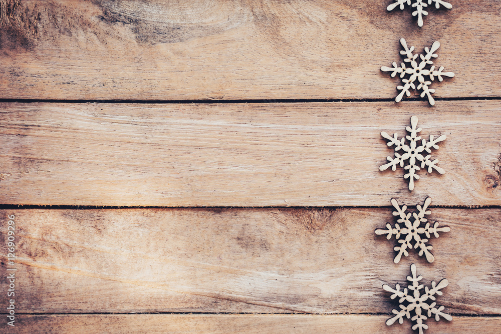 Fototapeta premium Snowflakes On Wood Background, Christmas Snow Flakes, Winter Dec