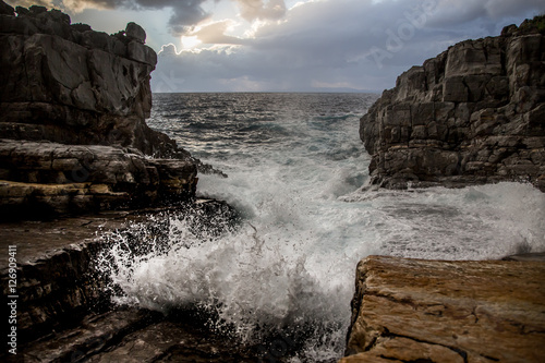 waves crashing on rocks