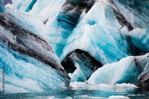 Photography Icebergs with volcano ashes in Jokulsarlon glacier lagoon, Iceland