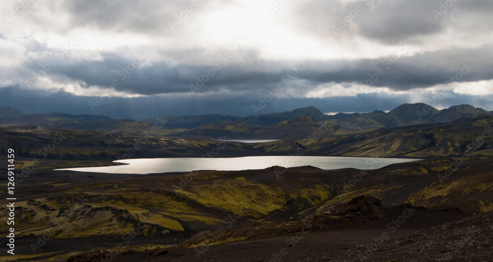 Iceland landscape with a lake and moss covered hills Iceland landscape with a lake and moss covered hills