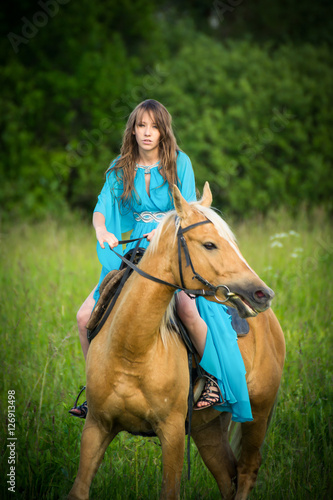 beautiful young girl with a horse 